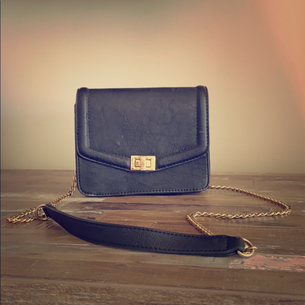 Small black suede handbag with gold chain handle